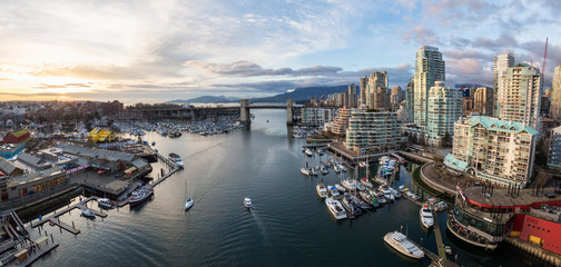 Aerial Panoramic view of the residential buildings and a market in False Creek, Downtown Vancouver, British Columbia, Canada.
