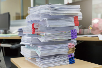 Business and finance concept of office working, Pile of unfinished documents on office desk, Stack of business paper