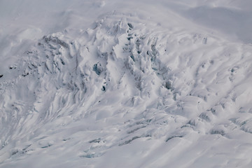 Crevasse on top of a remote glacier mountain in British Columbia, Canada, viewed from airplane.