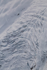 Obraz premium Crevasse on top of a remote glacier mountain in British Columbia, Canada, viewed from airplane.