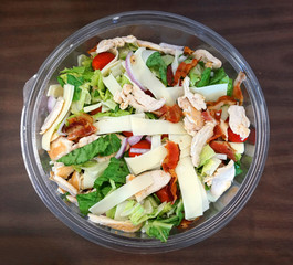 high angle view of fresh salad in glass bowl