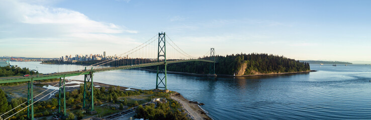 Fototapeta na wymiar Aerial Panoramic View of Lions Gate Bridge, Stanley Park and Downtown City in the background. Taken in Vancouver, British Columbia, Canada.