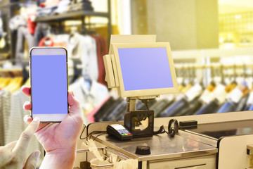POS point of sale machine and Hand holding smartphone for payment - Retail shopping of concept wtih techology using application