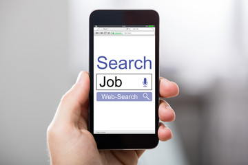 Hand Holding Cell Phone With Blank Screen