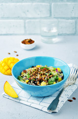 Mango black bean arugula pumpkin seed quinoa salad