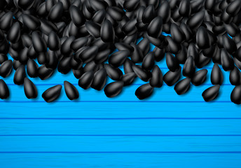 Sunflower seeds background with heap of black grains