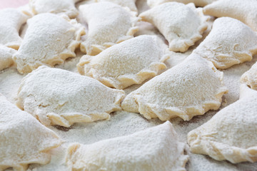 Cooking Vareniki, dumplings before boiling, traditional Ukrainian food