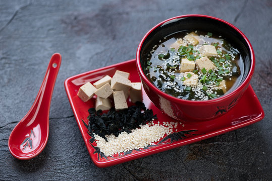 Miso soup with tofu cheese, wakame and sesame. Selective focus, studio shot