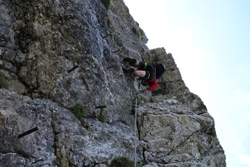 Climber in wall of Heli - Kraft - Klettersteig, Hochkar, Austria