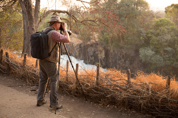 Fototapeta premium Photographer at Victoria Falls