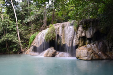 Fototapeta na wymiar Scenic view of waterfall in the forest (place of fish),erawan waterfall national park,kanchanaburi,thailand 