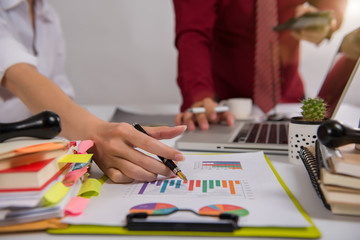 Fototapeta premium businesswoman hand working with finances about cost and calculator