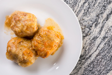 Served sarma in the plate above grey granite table background