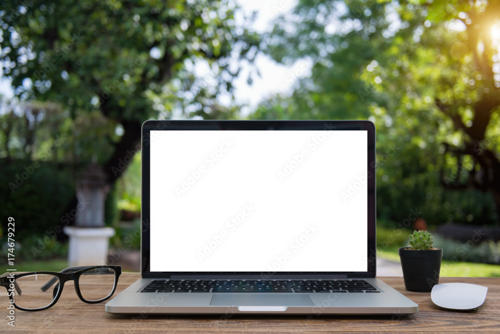Wall mural computer laptop and tablet computer on the table blur background with bokeh, business technology con