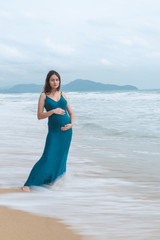 Young beautiful pregnant woman standing