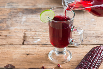 Purple corn juice wood table background