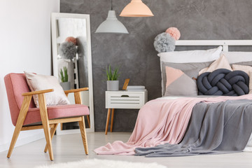Pink chair in girls bedroom