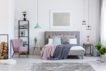 Pastel bedroom with comfortable chair