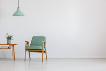 Open space with mint chair - obrazy, fototapety, plakaty