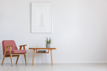 Pink chair next to table