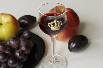Wine and Grapes. Young Red Wine and grapes isolated on White Background. Focus On Foreground.