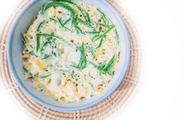 Egg custard with acacia pennata on white background