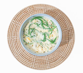 Egg custard with acacia pennata on white background