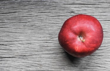 red apple on wooden background and space. fruit, natural food,