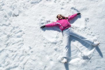 Woman lying on snow