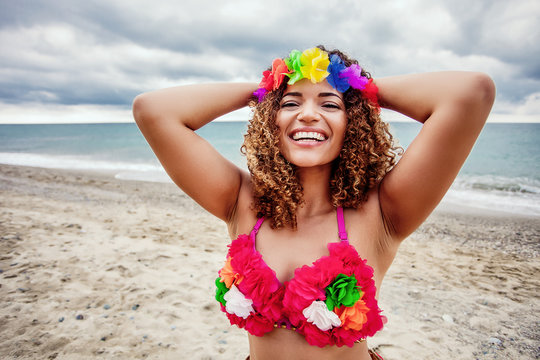 Happy Hawaiian woman portrait on the beach