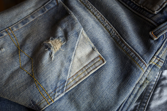Details of blue jeans in zipper, pockets