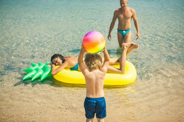 Pool. Family photo. Family summer day. Man and woman pool. Summer time. Dream. Child. Childhood. Kid. Kids.