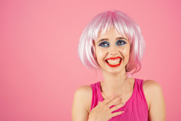 Girl smiling with bright artificial hair.