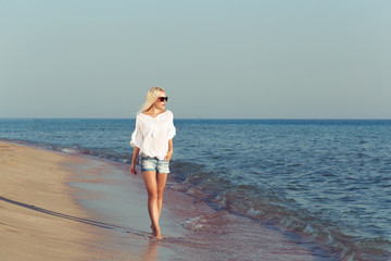 Young woman relaxing on the beach