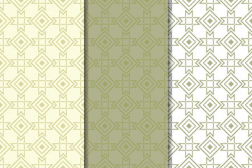 Olive green and white geometric ornaments. Set of seamless patterns