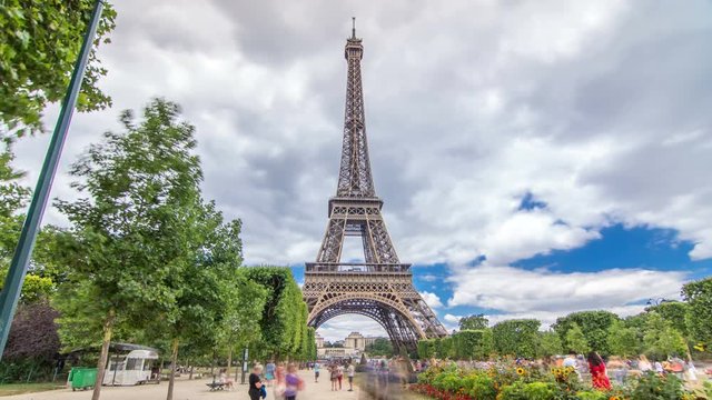 Champ de Mars and the Eiffel Tower timelapse hyperlapse in a sunny summer day. Paris, France
