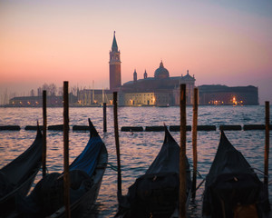 Venice with gondolas on Grand Canal against San Giorgio Maggiore church