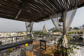 Roof top restaurant with beautiful view to Lake Pichola in the morning in Udaipur, Rajasthan, India