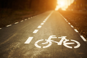 bike lane sign on cycleway at sunset