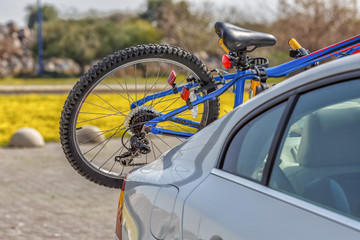 Bicycle attached to the car of the traveler