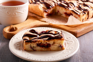 Sponge fruit cake with chocolate drizzle
