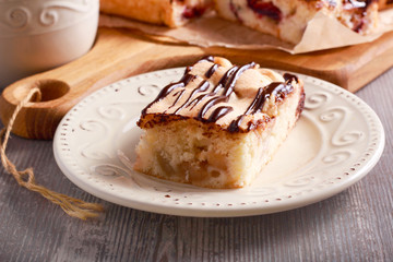 Apple and pear sponge cake with chocolate drizzle