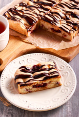Sponge fruit cake with chocolate drizzle
