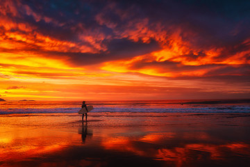 surfer in the beach sunset