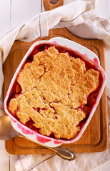 Plum and apple cobbler in a tin