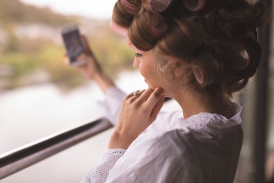 Bride taking selfie from mobile phone