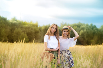 women with basket harvesting sunny smiling happy girls