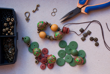 Assembly of beaded necklace from polymer clay with tools.