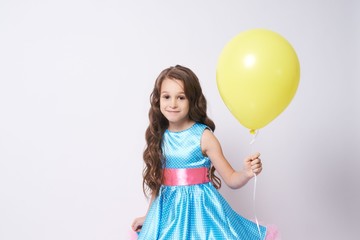 Celebration. Portrait girl. Happy child. Balloon. Dress.