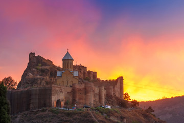 Amazing View of Narikala ancient fortress with St Nicholas Church at gorgeous sunset, Tbilisi, Georgia.